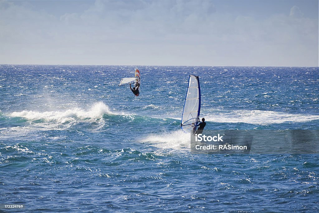 Sailing and Jumping "Sailboarders out and about at Hookipa Beach, Maui." Above Stock Photo