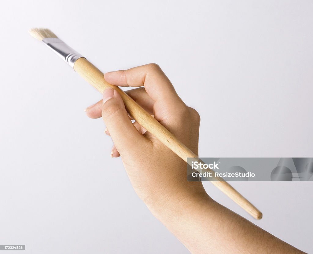 Hand with brush Close-up of hand with brush Backgrounds Stock Photo