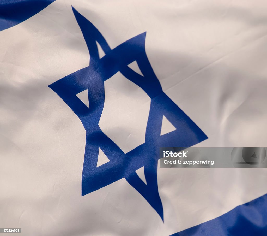 Flag Blowing with Star of David Flag in wind with Star capture. Blue Stock Photo