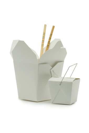 Two sizes of asian-style carryout containers and a pair of chopstick shot on white in the studioClick on the banner below to see more photos like this.