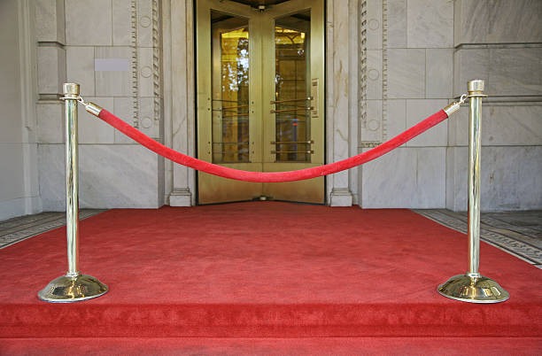 Red Velvet Rope Barrier "Blocked path on Red carpet, New York City, NY, USA." roped off stock pictures, royalty-free photos & images