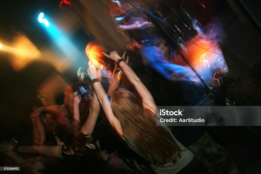 Rocking people Fans rocking at rock and roll show Party - Social Event Stock Photo