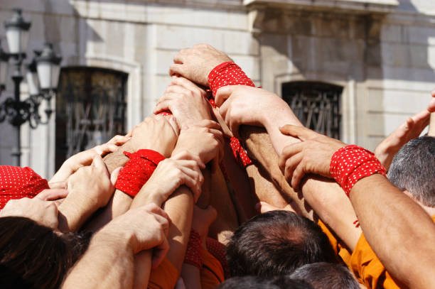 Hands of men in the struggle of national wrestling kuresh at sunny day, close up
