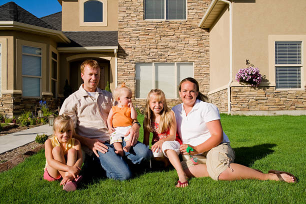 Family of Five at Home Photo of a happy family in front of their home. mormon woman photos stock pictures, royalty-free photos & images