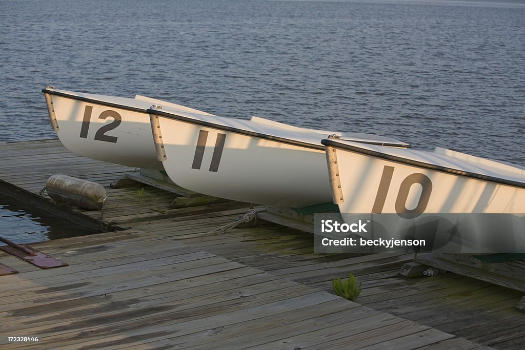 Three Boats Three boats at sunset drying on a dock.  Chestertown, Maryland.  Chester River.  Canon 5D camera. Blue Stock Photo