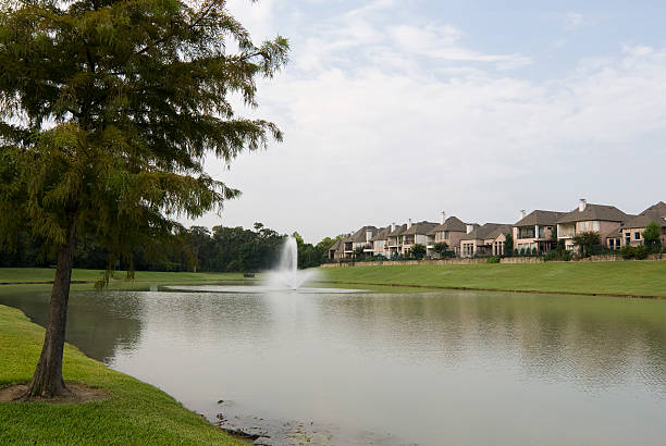 Scenic view of lake with village nearby stock photo