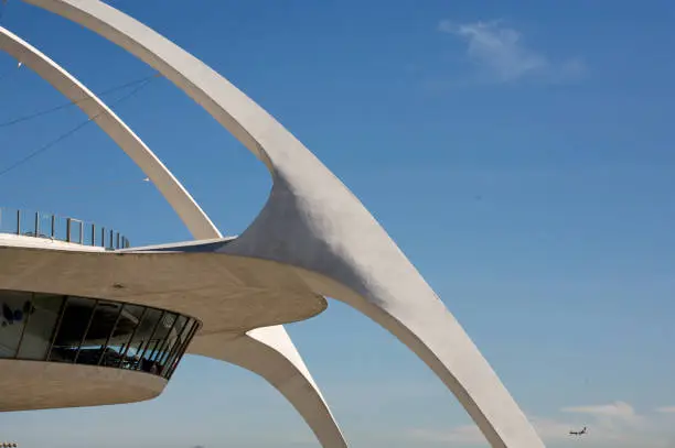 "The futuristic theme restaurant at Los Angeles International Airport, with a jet in the background"