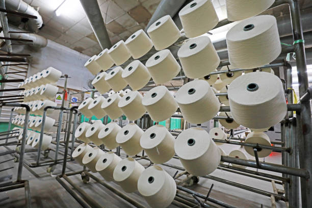 istock Cotton yarn piled up waiting to be packed in a spinning mill 1723299128