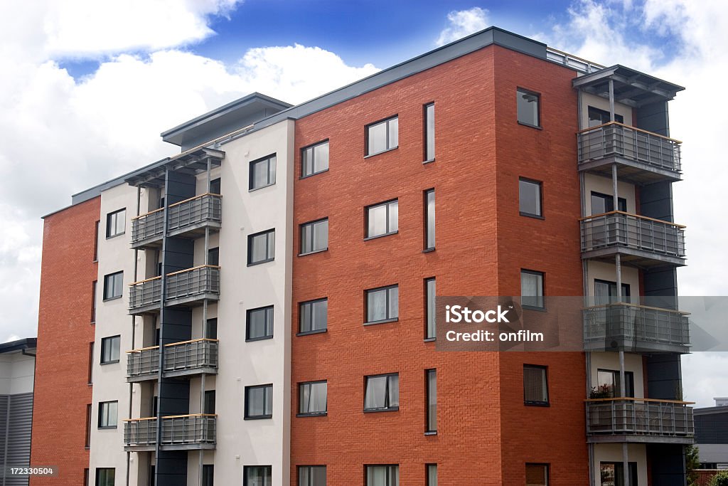 A modern orange and white apartment block  Modern apartment block in Altrincham, Cheshire, UK Apartment Stock Photo