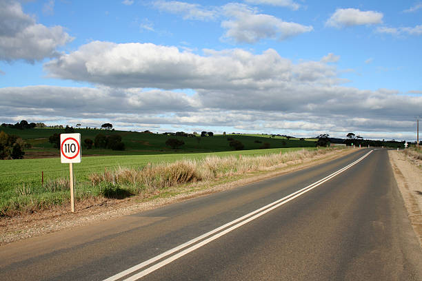 On the road The open road in South Australia where the top permitted speed limit is 110 kilometres per hour. grass shoulder stock pictures, royalty-free photos & images