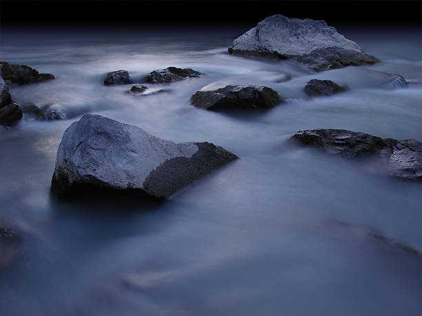 istock shore with rocks at night in silver moonlight 172330825