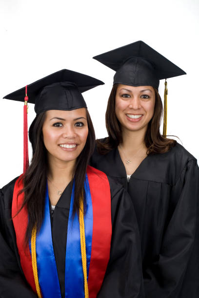 istock graduation girls with honor scarf 172330912
