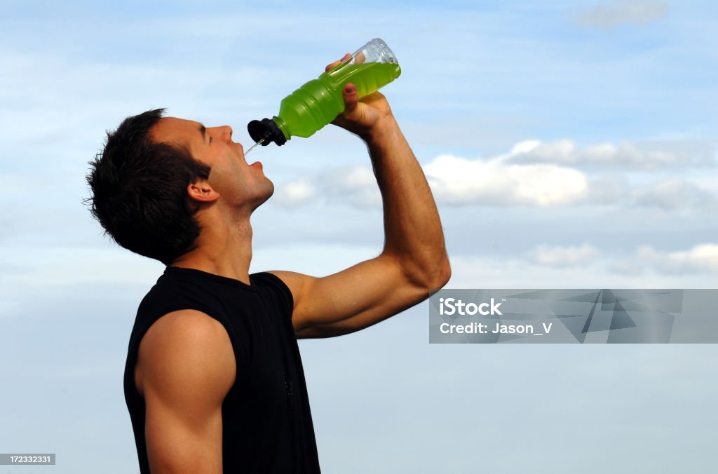 Fit man and sports drink 2 Fit man drinking a sports drink. Lots of space for copyOther Related Pictures in my portfolio: Drinking Stock Photo