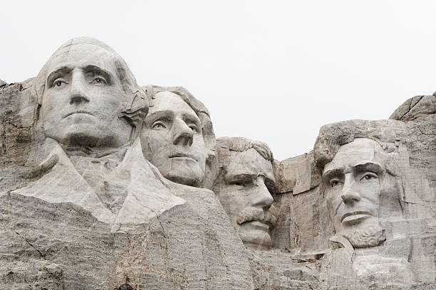 Mount Rushmore National Monument with USA Presidents in Mountain Stone "Subject: Mount Rushmore National Monument in a monochromatic lightLocation: Mount Rushmore, Black Hills, USA" theodore roosevelt us president stock pictures, royalty-free photos & images