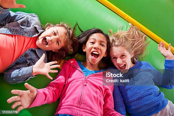 Girls Lying Down In Bounce House Stock Photo - Download Image Now - Bouncy Castle, Child, Playful