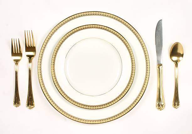 istock Elegant Table Setting with white and gold plates and silverware 172332922