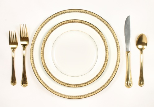 Gold trimmed plates set with gold tableware.Need a LARGE or EXTRA LARGE size Check my light box for a similar image that is availabe in those sizes.