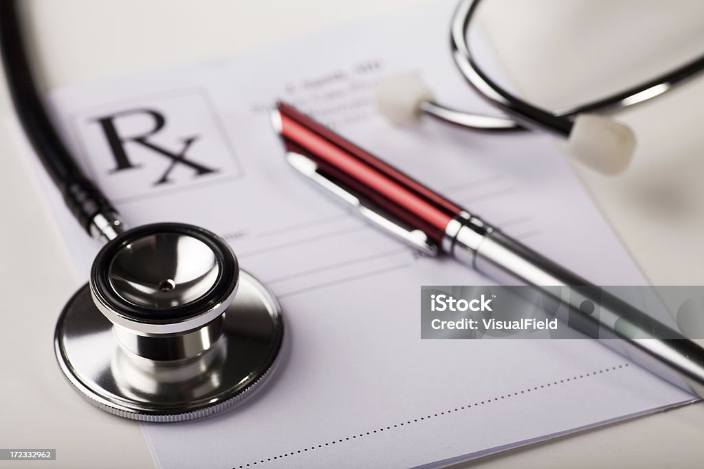 Prescription Pad & Stethoscope close-up stethoscope & pen on prescription pad Healthcare And Medicine Stock Photo