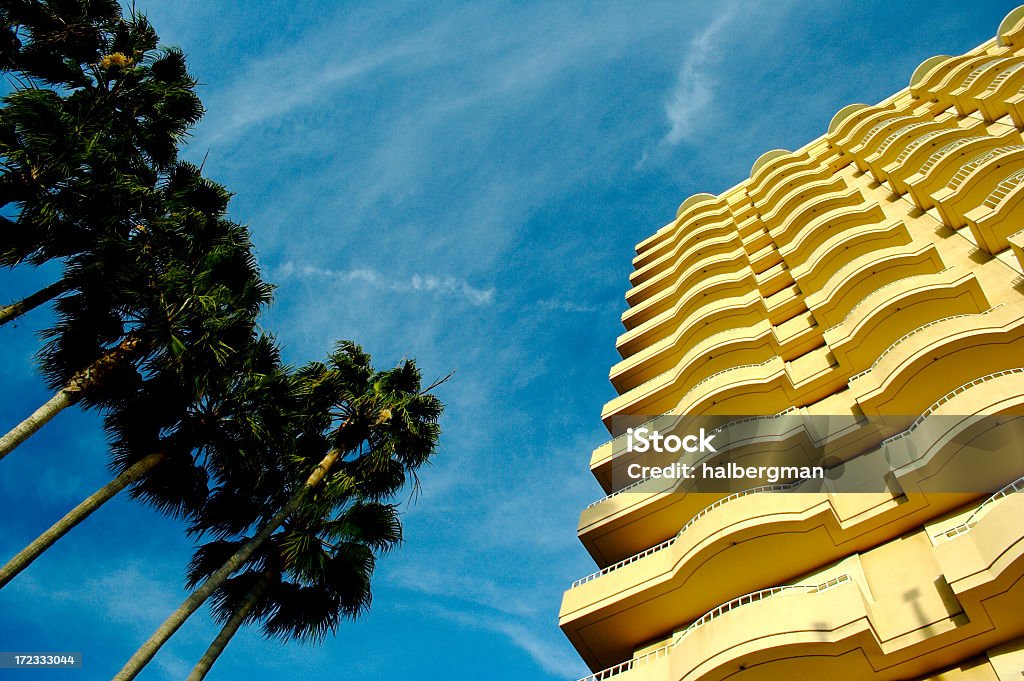 Palm trees and hotel Palm trees and a hotel Balcony Stock Photo