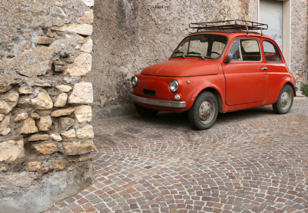 Sorrento, Italy - June 26, 2014: Rusty Classic Model of Fiat 500 Original Classic Car Abandoned at Parking.