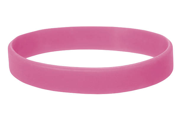 Pink Wristband Pink Wristband on a white background. This is a symbol of Breast Cancer. bracelet stock pictures, royalty-free photos & images