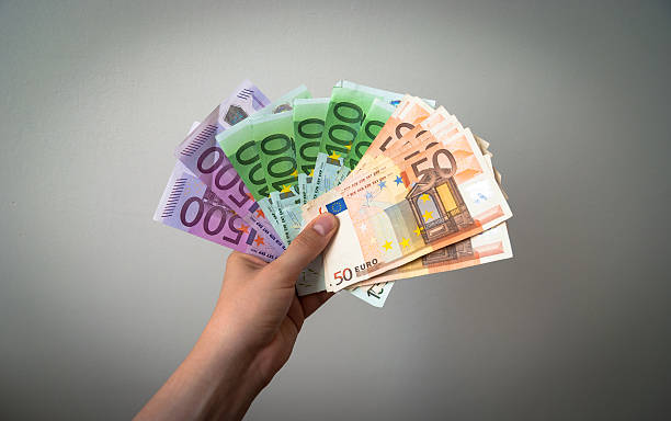 Male hand with Euros stock photo