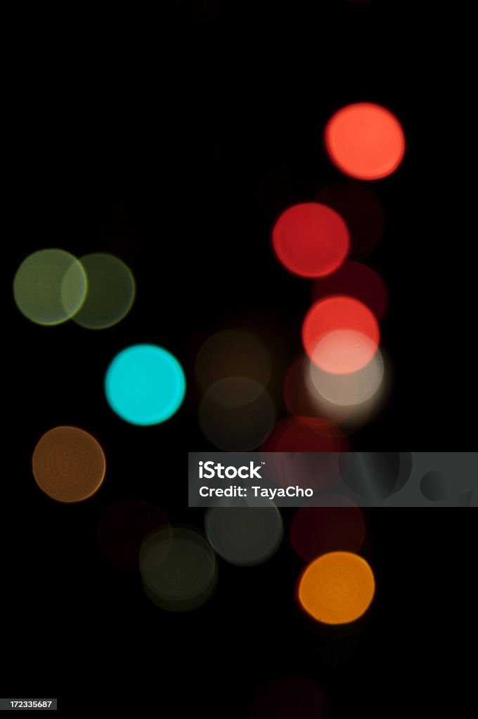 Sfocato luci su sfondo nero - Foto stock royalty-free di Arancione