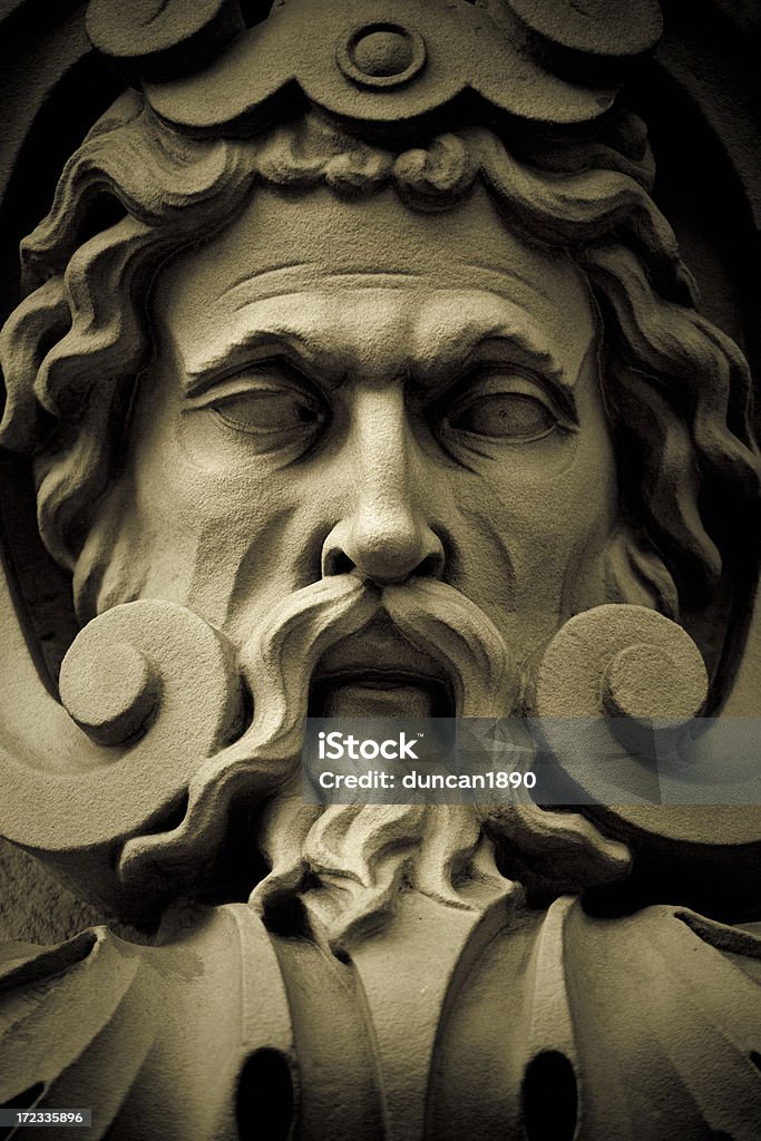 The lord of war Detail of an old sculpture depicting a god. Zeus Stock Photo