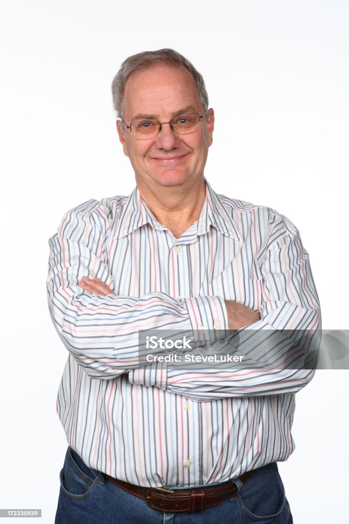 Smiling Arms Folded Smiling mature man in casual clothing. White Background Stock Photo
