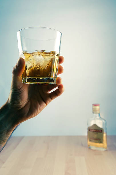 istock hand holding whiskey glass 172335965