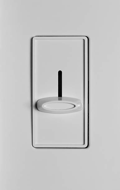Dimmer Switch OFF A dimmer switch in the OFF position at the bottom. dimmer switch photos stock pictures, royalty-free photos & images