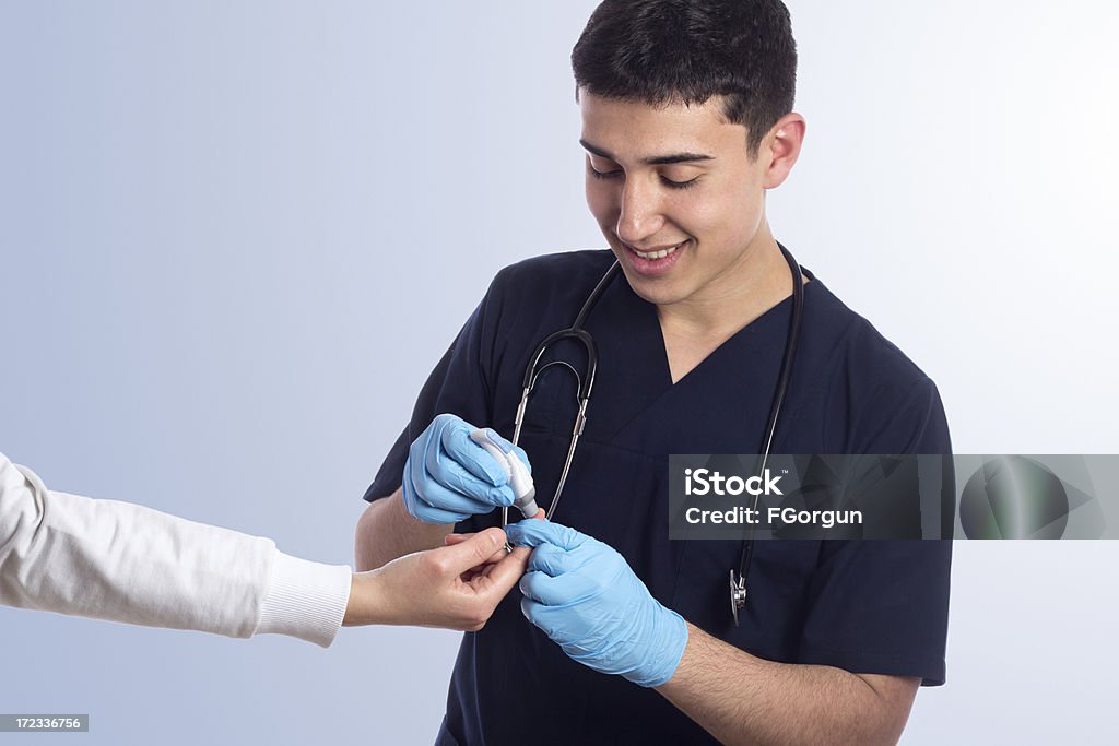 Blood sugar test The doctor checks at the diabetic a level of sugar in blood. Analyzing Stock Photo