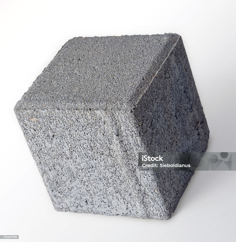 Cubic concrete paving stone isolated. Concrete Stock Photo