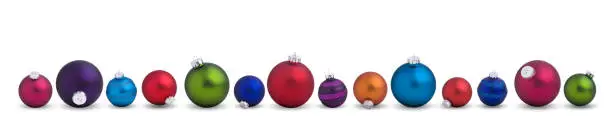 Photo of Colorful Christmas Baubles in a Row Isolated on White.