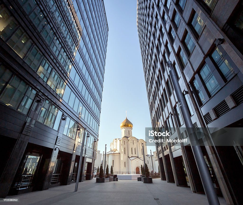 Unquenchable spirituality and modern business View of the Cathedral of St. Nicholas between modern office buildings, Moscow, Russia Architectural Dome Stock Photo