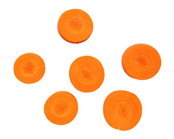 istock Beautiful orange  carrot slices isolated on white background with clipping path 1723389113
