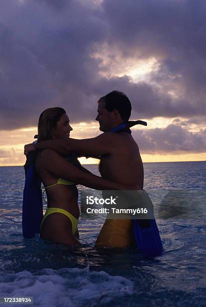 Romantic Couple Snorkeling Stock Photo - Download Image Now - Adult, Aquatic Sport, Back Lit