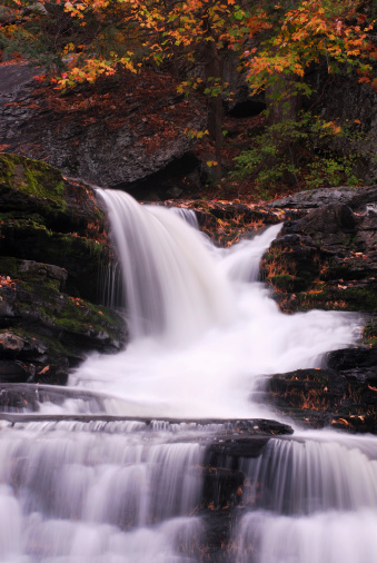 Waterfall cascade over rocks in autumn forest of Delaware Water Gap National Recreation Area