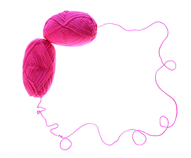 istock pink yarn skeins forming a frame on white 172339781