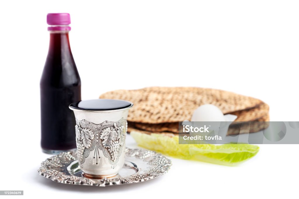 Passover Seder "Passover seder with wine, matzo, maror (romain lettuce), and an egg." Matzo Stock Photo