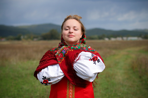 Young woman in traditional Russian dress & headscarf