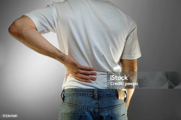 Back Pain Stock Photo - Download Image Now - Backache, Buttocks, Men