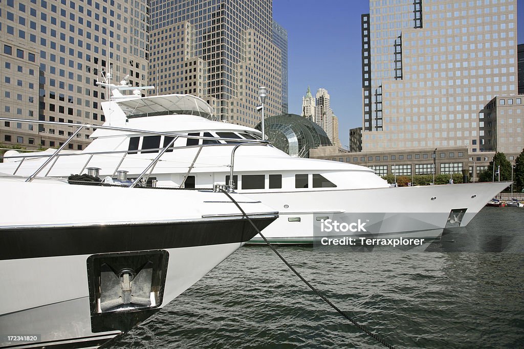 Luxury Yachts Moored In Front Of Office Buildings "Marina cove in Battery Park City, New York City, NY, USA." Anchor - Vessel Part Stock Photo