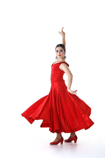 A woman in a red dress dancing flamenco stock photo
