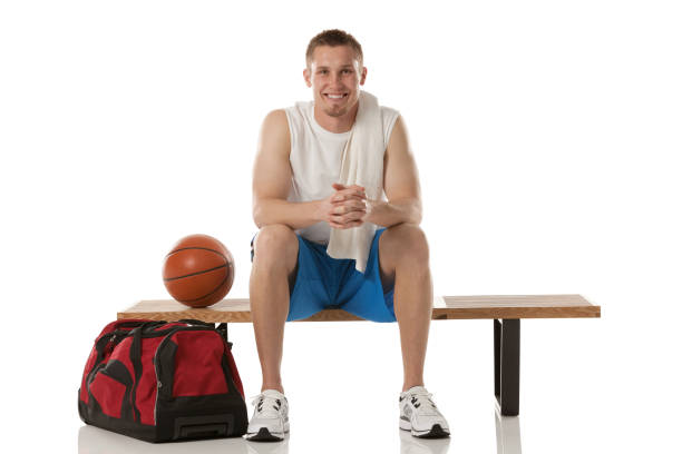 istock Happy basketball player sitting on a bench 172342332