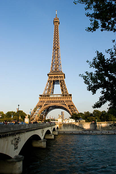 Famous Eiffel Tower with blue sky and some white clouds seen from Trocadero Hill in Paris France