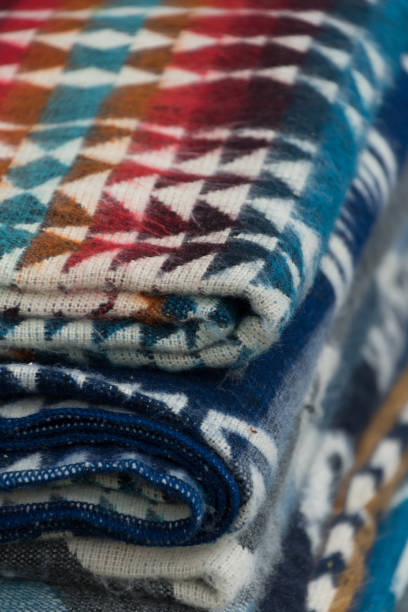 Pile of blankets in traditional indigenous style in market in Santa Fe -2 stock photo