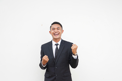 Smiling businessman pointing awayhttp://www.twodozendesign.info/i/1.png