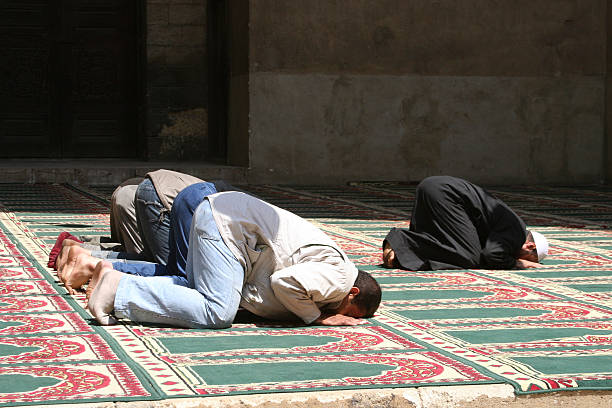 Muslims Praying in a mosque in Cairo, Egypt.