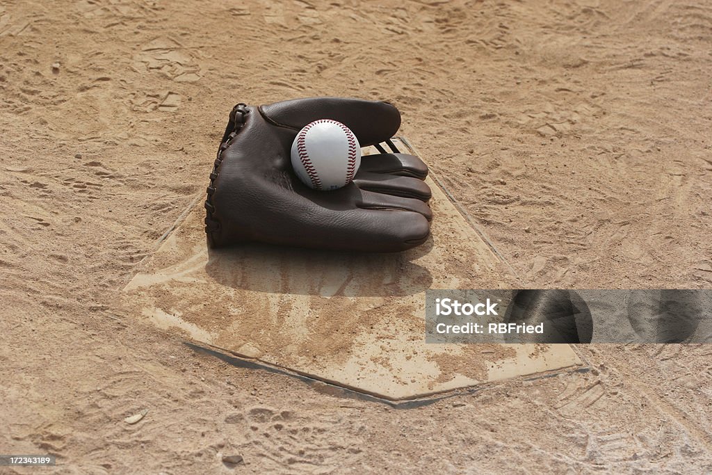 Baseball an old baseball glove at home plate Antique Stock Photo